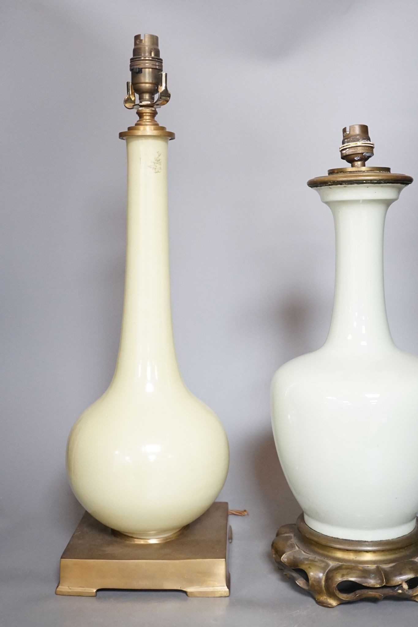 Two Chinese celadon glazed converted lamps, 44cm